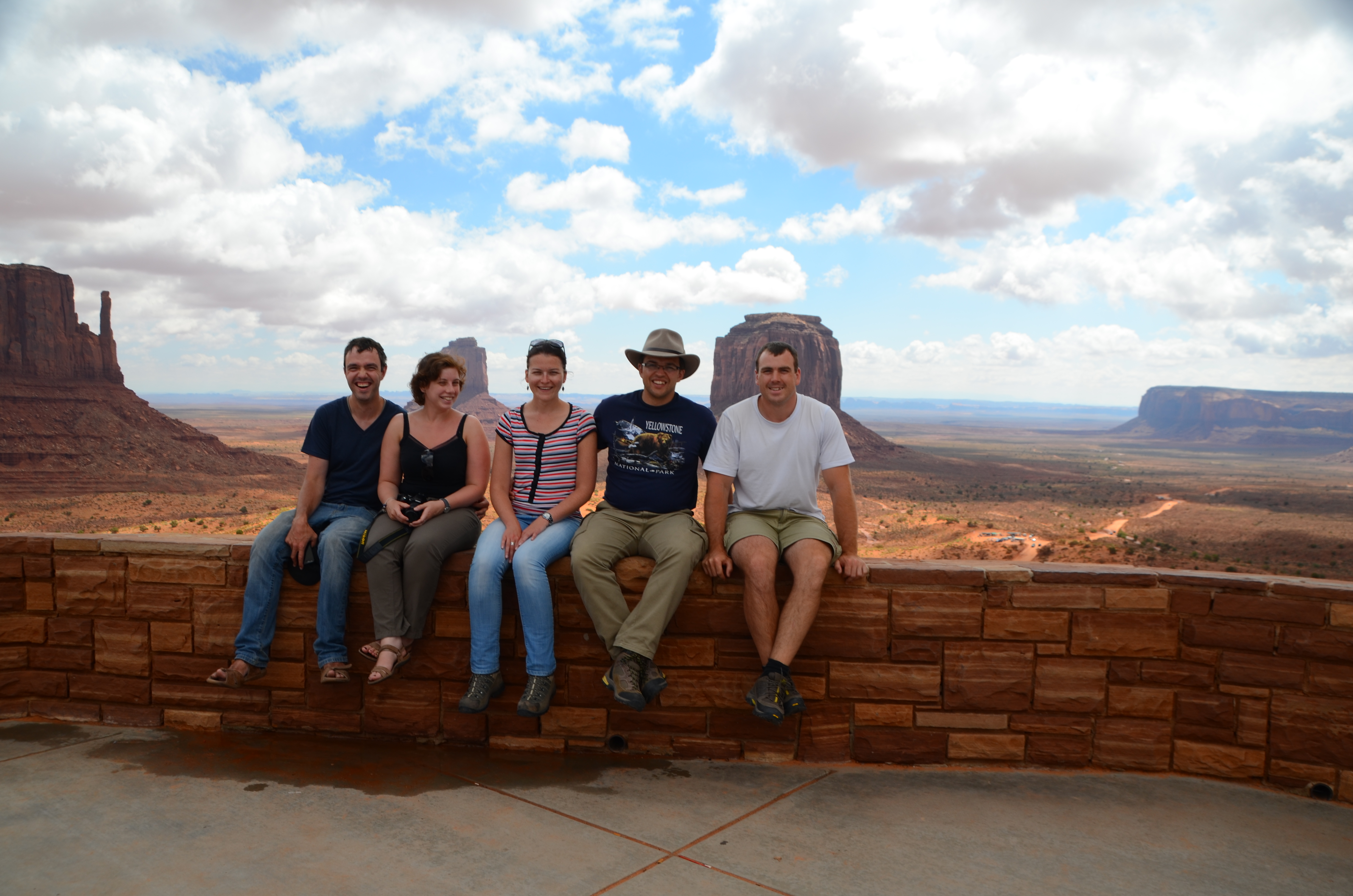 5 people sitting on the rock